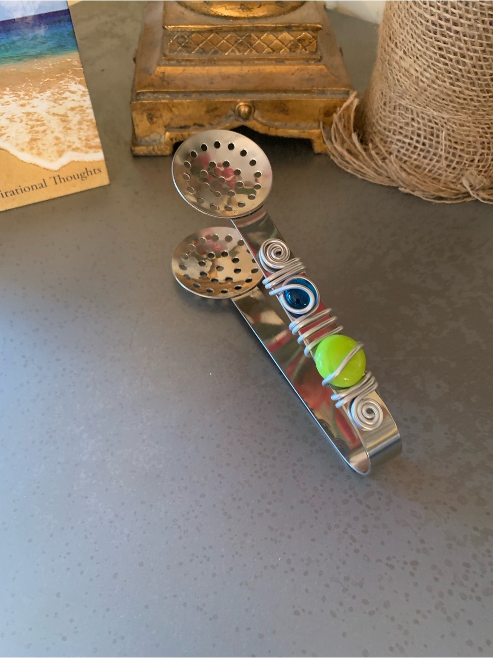 Stainless Steel tea bag squeezer, wire with GREEN and BLUE stones.